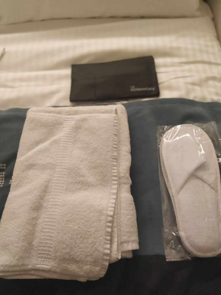 Towel, slippers and toiletries - The Millennials Kyoto